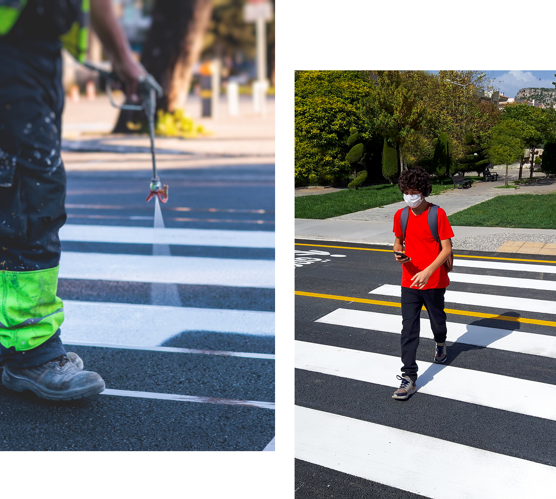 Painting crosswalk and person crossing street.