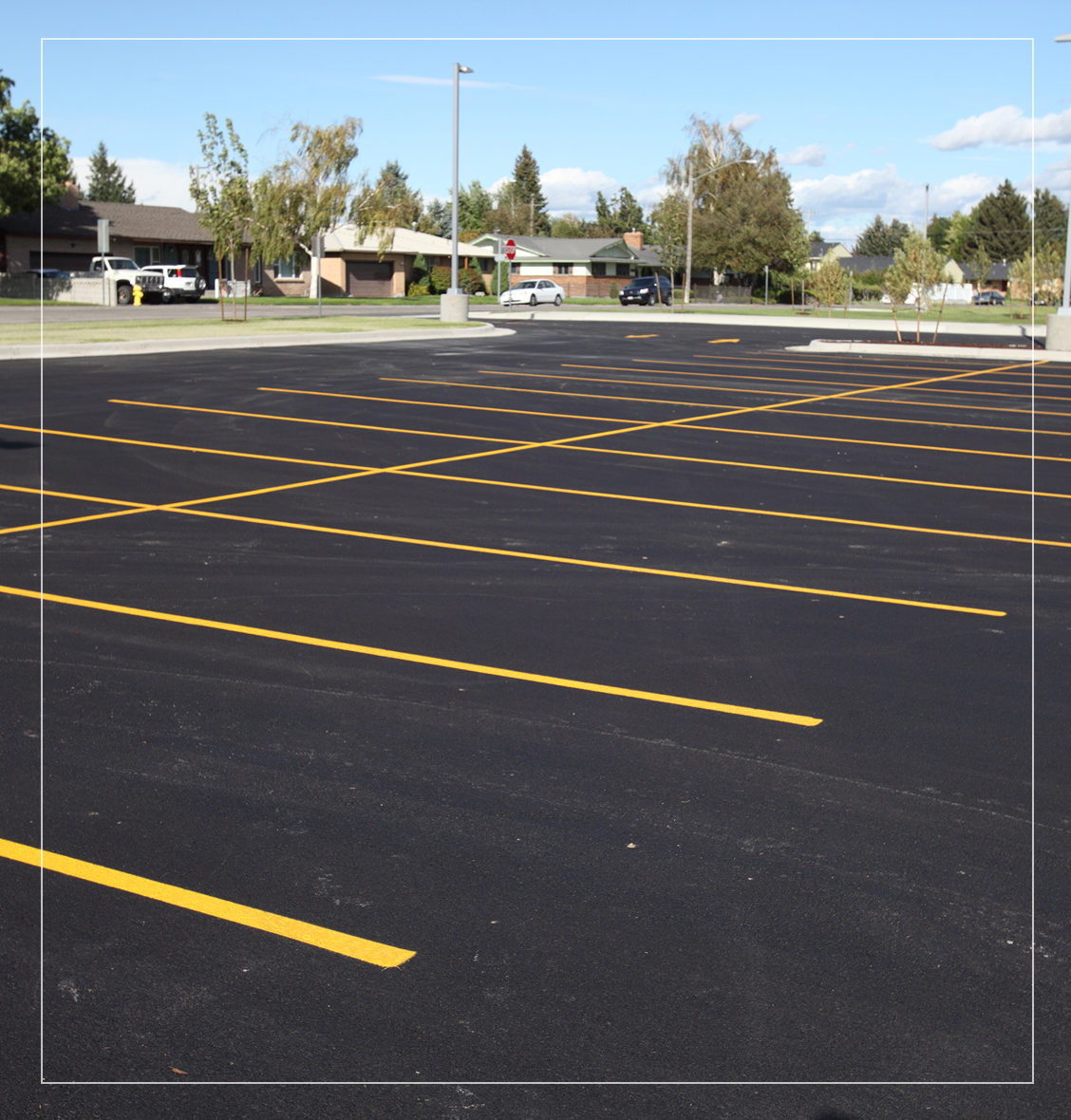 Empty parking lot with yellow lines.